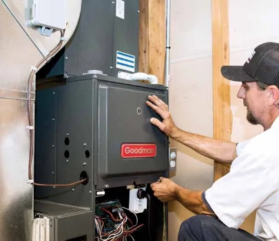 hvac technician installing a Goodman Furnace